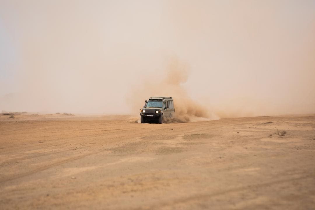 Safari vehicle on the way to game drive in Tanzania