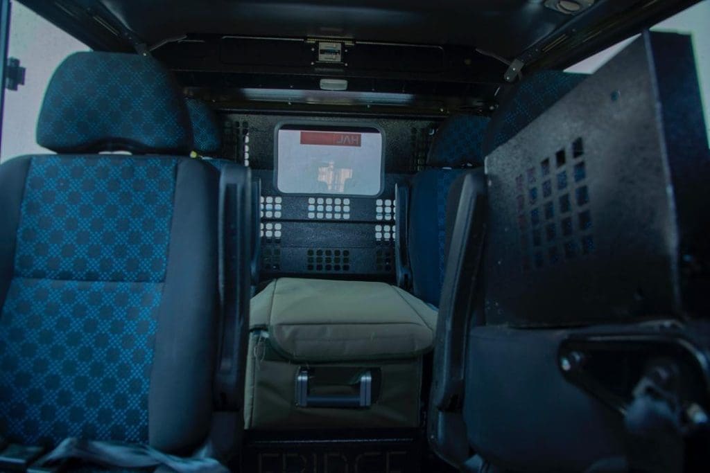 Rear interior of a Tanzania safari vehicle with medical stretcher setup for emergency evacuation and safety support.